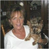 Team member Brenda Lyle Loomis with her small Yorkshire Terrier